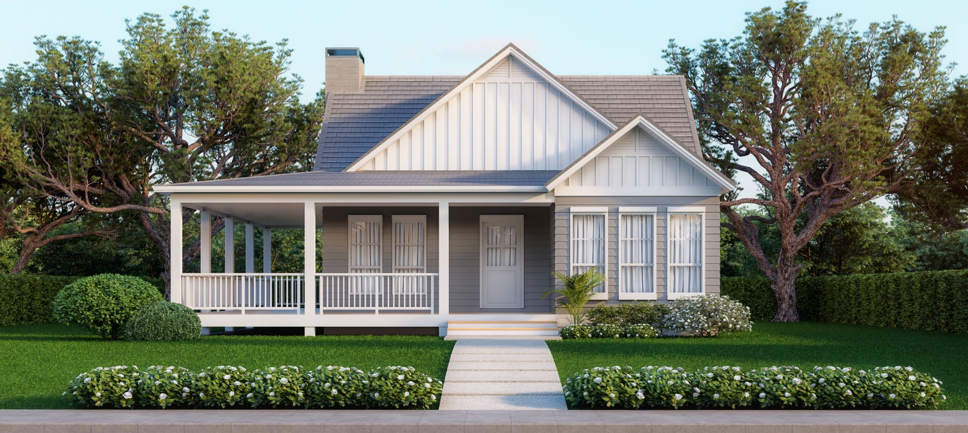 Charming white house with a spacious front porch and well-kept garden.